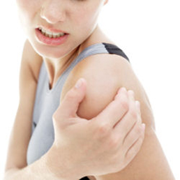 Woman suffering with a frozen shoulder